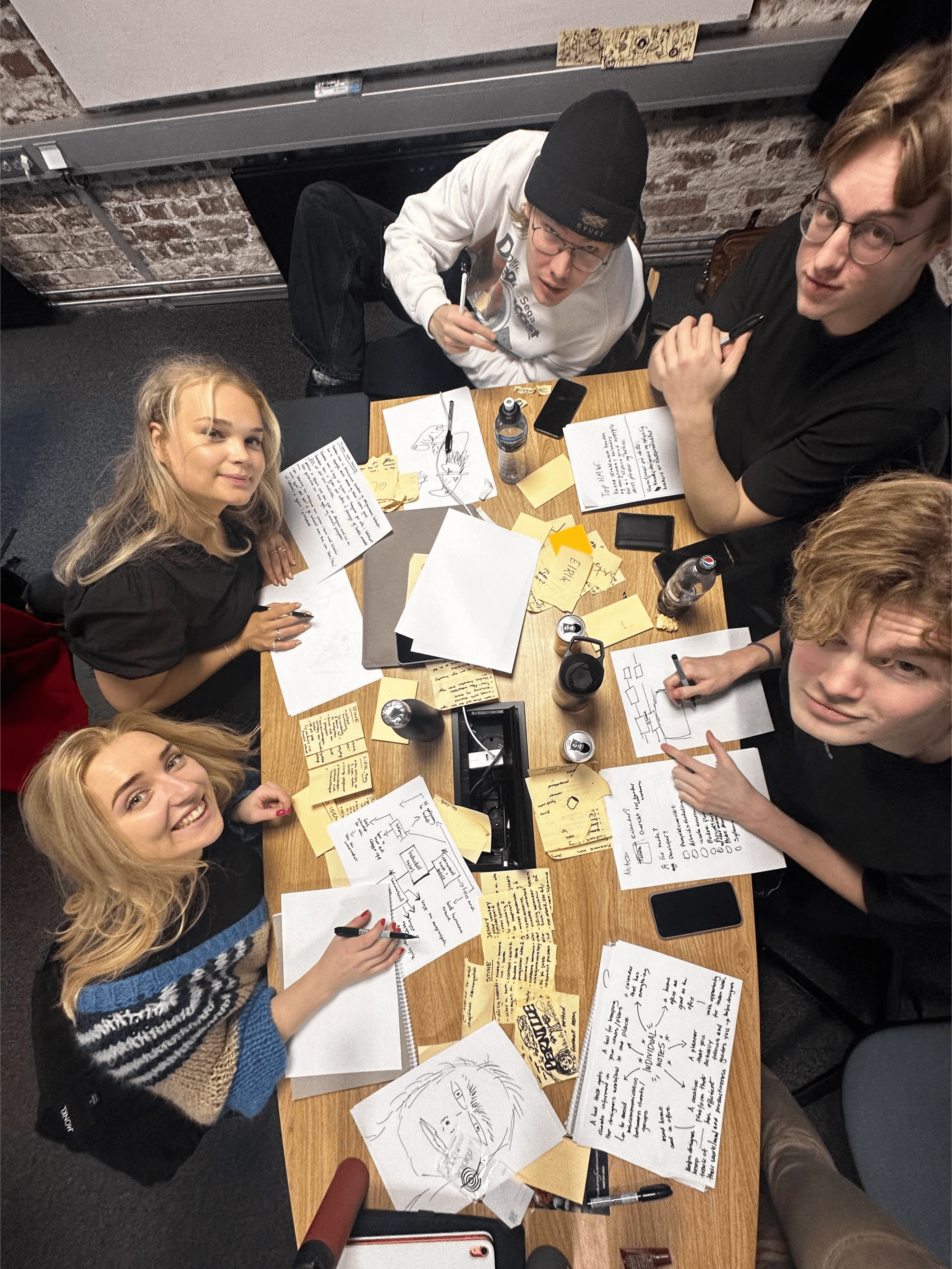 Stine and her project-group doing a creative exercise while working on the OurSpace design.